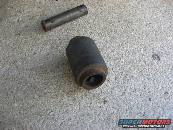 Leaf spring bushing and metal sleeve on concrete
