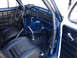 1964 Volkswagen Beetle - The interior of a modified Volkswagen Beetle features a roll cage and racing-style seats.