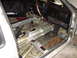 1985 Volkswagen GTI - The interior of a 1985 Volkswagen GTI shows significant rust on the floor pans and has been stripped of its carpeting.