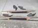 1993 Ford Bronco - These running boards and their mounting brackets are laid out on a concrete surface.