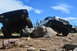 1983 Ford Bronco - Two Jeeps navigate a rocky off-road course under a bright blue sky.