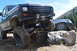1983 Ford Bronco - This lifted truck is navigating a rocky trail with another vehicle in the background.