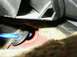 1998 Mercury Sable - Interior view shows a wire being routed through a grommet in the car's body.
