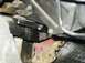 1998 Mercury Sable - Close-up view of vehicle undercarriage components, showing various metal and plastic parts.