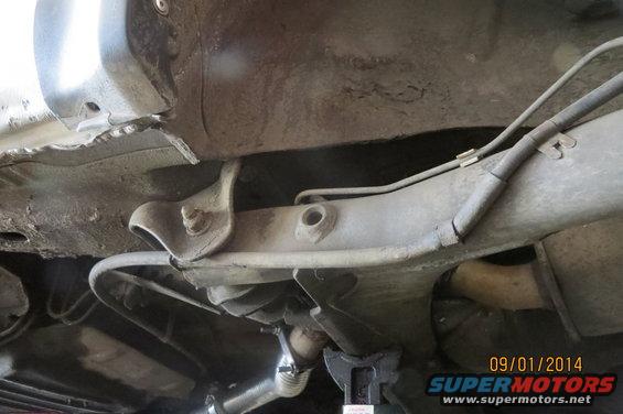 Underbody view of car suspension and exhaust system. Date stamp reads 09/01/2014