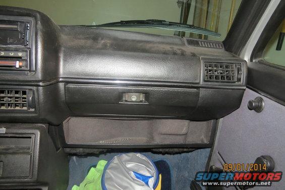 dashboard with radio, vents, and glove box