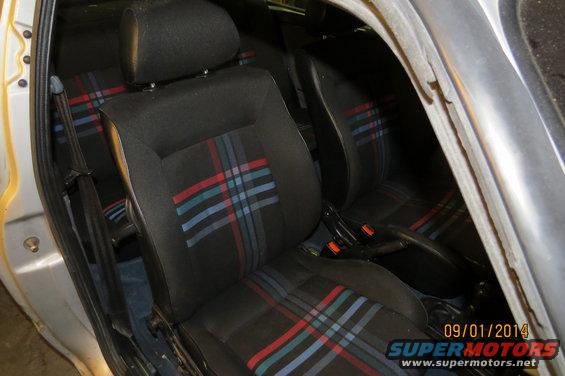 1985 Volkswagen GTI interior showing plaid seats and center console