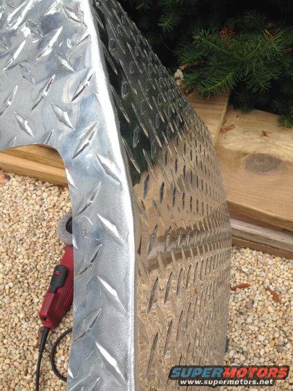 Diamond plate metal part with grinder