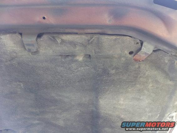 Hood blanket with visible mounting points and some discoloration