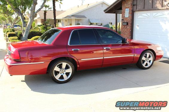 Red 2002 Mercury Grand Marquis parked on concrete driveway