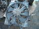 1980 Ford Bronco - A dusty radiator fan is shown from a top-down perspective, with various engine parts in the background.