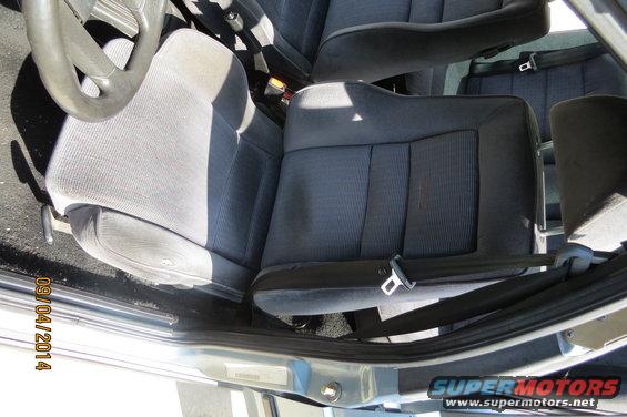 Interior view of car seats and steering wheel. Date stamp reads 09/04/2014