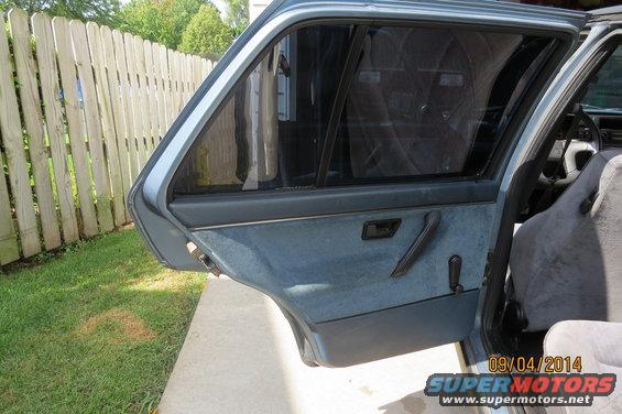 1990 Volkswagen Jetta interior showing blue door panel and seats