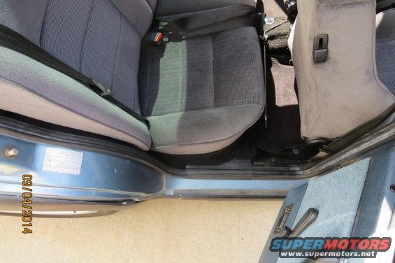 Car interior showing front seats and door panel. Date stamp on door reads 09/04/2014