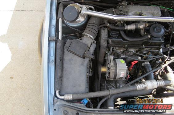 Engine bay with visible date stamp and SuperMotors logo