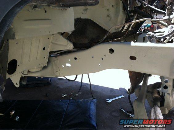Frame and suspension components with tools on the ground