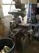1995 Mercury Grand Marquis - A milling machine is shown in a workshop setting with various tools and equipment in the background.
