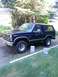 1986 Ford Bronco - This Ford Bronco features a chrome grille and trim, with a dark blue exterior.