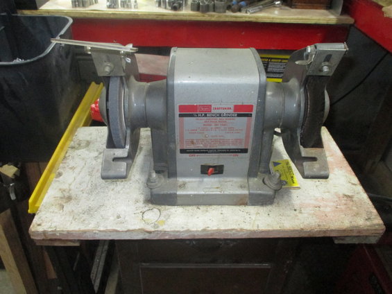 Craftsman 1/2 H.P. Bench Grinder on a wooden stand