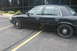 2009 Ford Crown Victoria - Side view of a black 2009 Ford Crown Victoria parked in a lot.