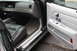 2009 Ford Crown Victoria - The interior of a 2009 Ford Crown Victoria is visible, black leather seats and a light-colored door panel.