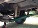 1971 Ford F-250 - The underside of a truck reveals a green driveshaft and rear axle assembly.