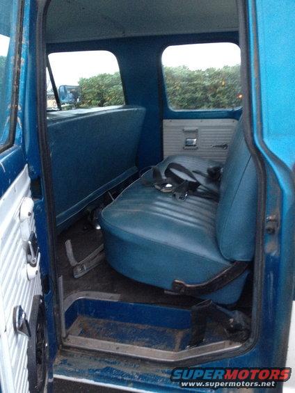1971 Ford F-250 interior showing blue vinyl bench seat and door panel