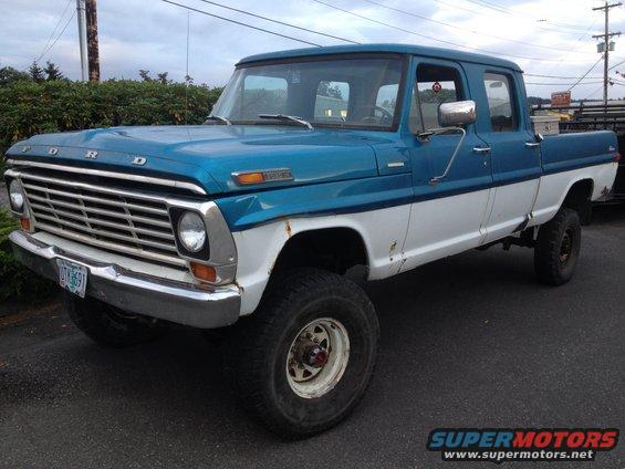 1971 Ford F-250 pickup truck, blue and white two-tone paint, lifted suspension