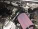 1988 Ford Bronco - Close-up of an engine bay, a turbocharger and an aftermarket air intake system.