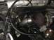 1988 Ford Bronco - Close-up view of a turbocharger and associated engine parts within a vehicle's engine compartment.