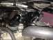 1988 Ford Bronco - Close-up view of an engine bay, showing various components including a turbocharger and air intake system.