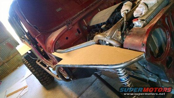 1985 Jeep CJ7 chassis with custom roll cage and suspension, red body