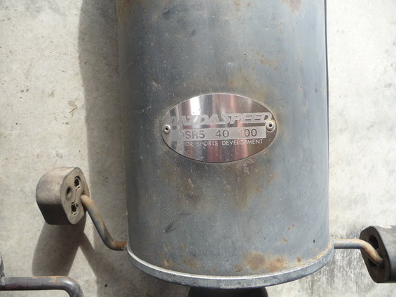 Mazdaspeed muffler with part number PSR5 40 100 and text 'FOR SPORTS DEVELOPMENT'