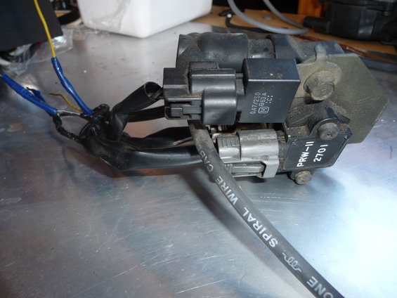 Ignition coil pack with connectors and wiring, part number PRW-11 2701 visible
