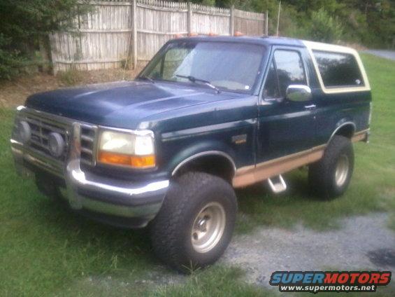 1994 Ford Bronco, dark green with white top, 3/4 front view