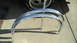 1994 Jeep Cherokee - Two chrome fender trim pieces are shown, with a tire and wheel visible behind them. The registry lists this as a 1994 Jeep Cherokee part, b…
