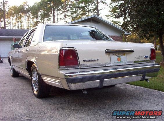 Rear view of a cream 1990 Ford Crown Victoria LTD parked on a driveway