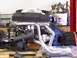 1974 Dodge Challenger - Engine assembly with chrome headers and intake manifold, likely undergoing installation or repair.