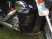 1998 Honda Shadow VT750C - Close-up of a motorcycle's black side panel a 'Patriots Pray' decal and other stickers.