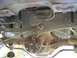 1999 Mercury Grand Marquis - This photo shows the rear differential and fuel pump assembly from underneath a vehicle.