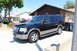 2003 Ford Expedition - A black 2003 Ford Expedition is parked in a driveway next to a red vehicle.