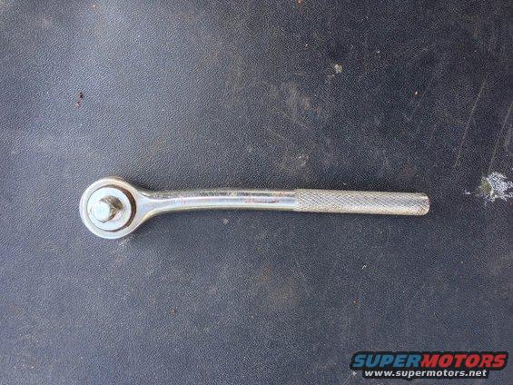 Ratchet wrench on a dark surface