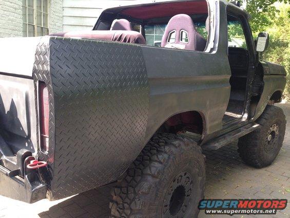 1979 Ford Bronco rear quarter panels with diamond plate, racing seats visible