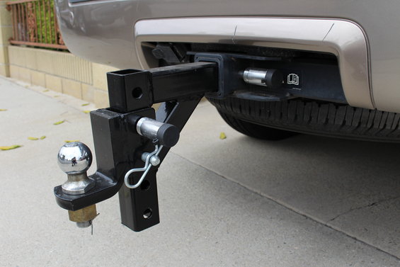 2003 Ford Expedition rear bumper with a trailer hitch and ball mount attached