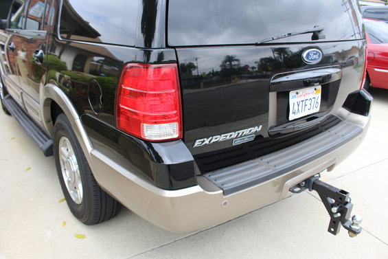 Black Ford Expedition rear view with a trailer hitch