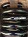 1979 Ford Bronco - Close-up of a black coil spring with "WILD HORSES" branding visible.
