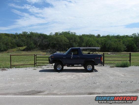 Blue 1982 Ford Bronco side view with soft top up