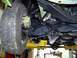 1974 Dodge Challenger - Underside view of a vehicle's front suspension components, including the tire and brake assembly.