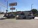 1997 Dodge 3500 - Truck camper and boat trailer combination seen at a gas station.