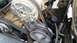 1988 Ford Bronco - Close-up view of engine components including pulleys, belts, and a power steering pump.